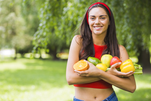 smiling young woman holding fresh vegetables fruits hands 23 2147855491